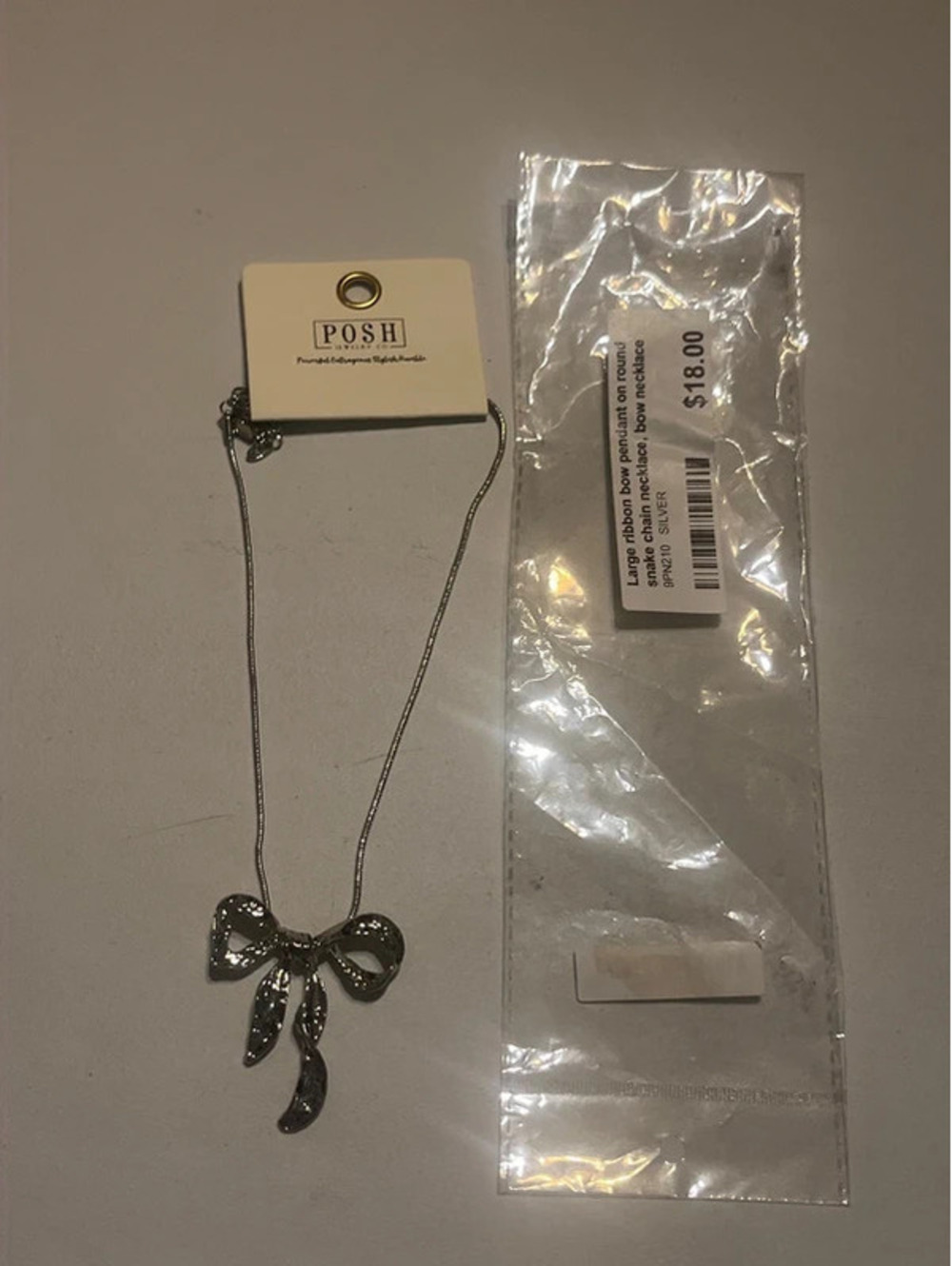 0066 Posh Jewelry Co. Silver Textured Coquette Bow Pendant Necklace NWT